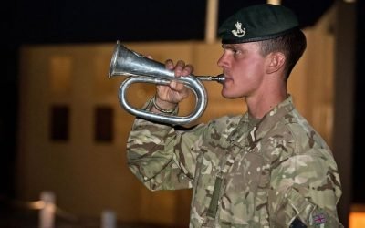 A soldier plays the Last Post at Camp Bastion